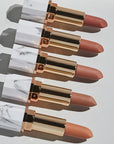 Achieve fuller lips with Nubyén Super Nudes Plumping Lipstick. Vegan, cruelty-free, moisture-matte lipstick infused with peppermint, eucalyptus, lemongrass, and collagen to enhance lip volume naturally. Available in 10 flattering nude shades, perfect for a soft, plump, kissable pout. Safe to use with or without fillers. Clean beauty formula, free of parabens, sulfates, and phthalates.