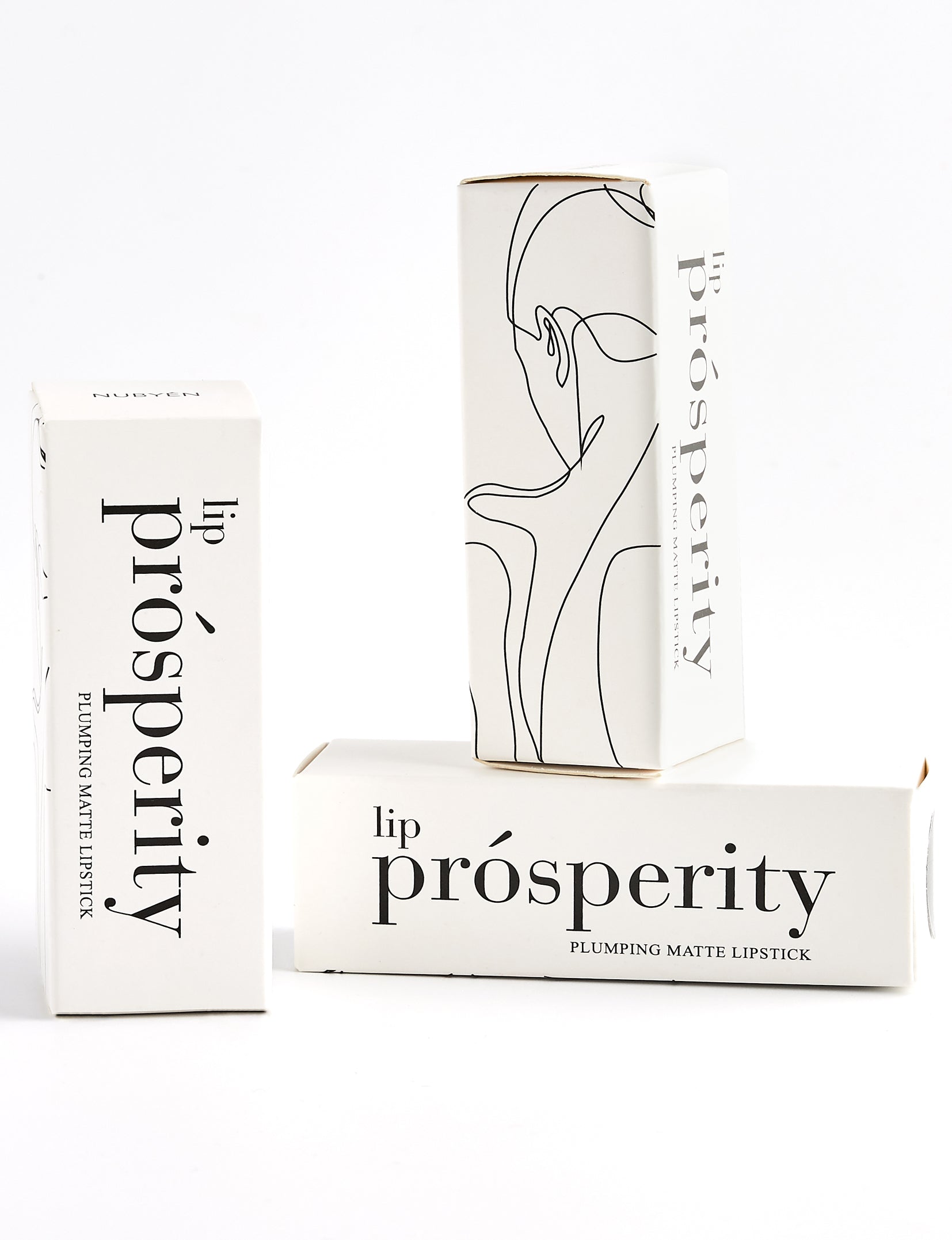 Nubyén Lip Prosperity Plumping Matte Lipstick – A luxurious matte lipstick that plumps, hydrates, and enhances lip volume naturally. Infused with nourishing ingredients like hyaluronic acid and cinnamon, it delivers bold, long-lasting color while keeping lips smooth and moisturized. 100% vegan, cruelty-free, and free from parabens and sulfates, this lipstick is perfect for fuller, healthier-looking lips. Created by medical professionals, it combines beauty and science for confident, radiant results