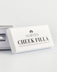 Enhance your cheekbones naturally with Nubyen Cheek Fillá, a clean, vegan cheek-lifting elixir enriched with hyaluronic acid, cinnamon, and AHA fruit extracts for hydration, plumping, and brightening. Perfect for sculpted, radiant cheeks without injections. Eco-friendly glass packaging.