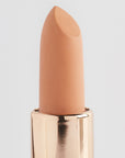 Achieve fuller lips with Nubyén Super Nudes Plumping Lipstick. Vegan, cruelty-free, moisture-matte lipstick infused with peppermint, eucalyptus, lemongrass, and collagen to enhance lip volume naturally. Available in 10 flattering nude shades, perfect for a soft, plump, kissable pout. Safe to use with or without fillers. Clean beauty formula, free of parabens, sulfates, and phthalates.