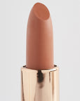 Achieve fuller lips with Nubyén Super Nudes Plumping Lipstick. Vegan, cruelty-free, moisture-matte lipstick infused with peppermint, eucalyptus, lemongrass, and collagen to enhance lip volume naturally. Available in 10 flattering nude shades, perfect for a soft, plump, kissable pout. Safe to use with or without fillers. Clean beauty formula, free of parabens, sulfates, and phthalates.