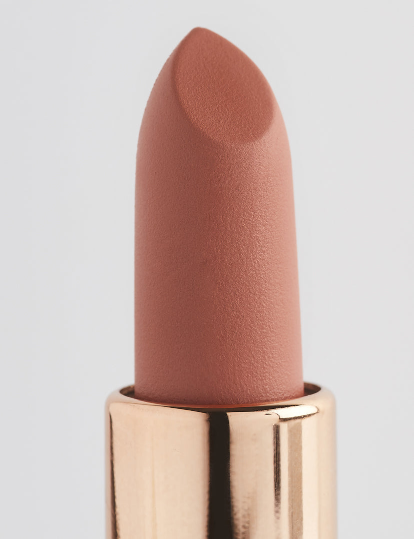 Achieve fuller lips with Nubyén Super Nudes Plumping Lipstick. Vegan, cruelty-free, moisture-matte lipstick infused with peppermint, eucalyptus, lemongrass, and collagen to enhance lip volume naturally. Available in 10 flattering nude shades, perfect for a soft, plump, kissable pout. Safe to use with or without fillers. Clean beauty formula, free of parabens, sulfates, and phthalates.