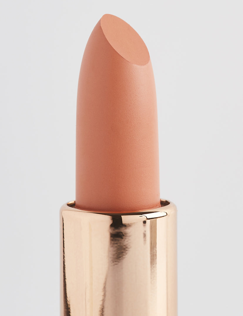 Achieve fuller lips with Nubyén Super Nudes Plumping Lipstick. Vegan, cruelty-free, moisture-matte lipstick infused with peppermint, eucalyptus, lemongrass, and collagen to enhance lip volume naturally. Available in 10 flattering nude shades, perfect for a soft, plump, kissable pout. Safe to use with or without fillers. Clean beauty formula, free of parabens, sulfates, and phthalates.