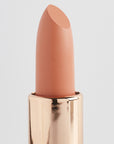 Achieve fuller lips with Nubyén Super Nudes Plumping Lipstick. Vegan, cruelty-free, moisture-matte lipstick infused with peppermint, eucalyptus, lemongrass, and collagen to enhance lip volume naturally. Available in 10 flattering nude shades, perfect for a soft, plump, kissable pout. Safe to use with or without fillers. Clean beauty formula, free of parabens, sulfates, and phthalates.