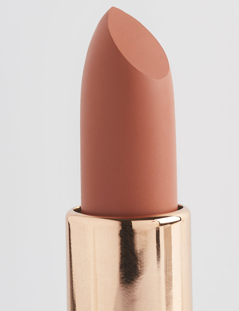 Achieve fuller lips with Nubyén Super Nudes Plumping Lipstick. Vegan, cruelty-free, moisture-matte lipstick infused with peppermint, eucalyptus, lemongrass, and collagen to enhance lip volume naturally. Available in 10 flattering nude shades, perfect for a soft, plump, kissable pout. Safe to use with or without fillers. Clean beauty formula, free of parabens, sulfates, and phthalates.