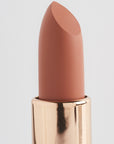 Achieve fuller lips with Nubyén Super Nudes Plumping Lipstick. Vegan, cruelty-free, moisture-matte lipstick infused with peppermint, eucalyptus, lemongrass, and collagen to enhance lip volume naturally. Available in 10 flattering nude shades, perfect for a soft, plump, kissable pout. Safe to use with or without fillers. Clean beauty formula, free of parabens, sulfates, and phthalates.